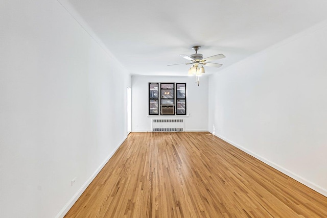 123-35 82nd Rd Unit 4H, Kew Gardens, NY 11415 - empty room with radiator heating unit, light wood finished floors, a ceiling fan, baseboards, and cooling unit