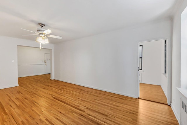 123-35 82nd Rd Unit 4H, Kew Gardens, NY 11415 - empty room featuring light wood finished floors, ceiling fan, and baseboards