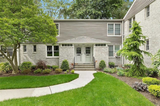 82U Glen Keith Rd Unit 82U, Glen Cove, NY 11542 - view of front of house with a front lawn and brick siding