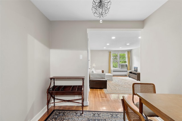 82U Glen Keith Rd Unit 82U, Glen Cove, NY 11542 - hall featuring radiator, light wood finished floors, recessed lighting, and cooling unit