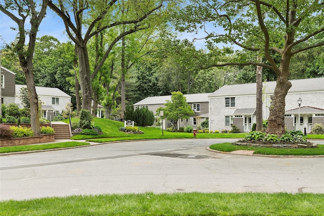 82U Glen Keith Rd Unit 82U, Glen Cove, NY 11542 - view of asphalt street with curbs and a residential view