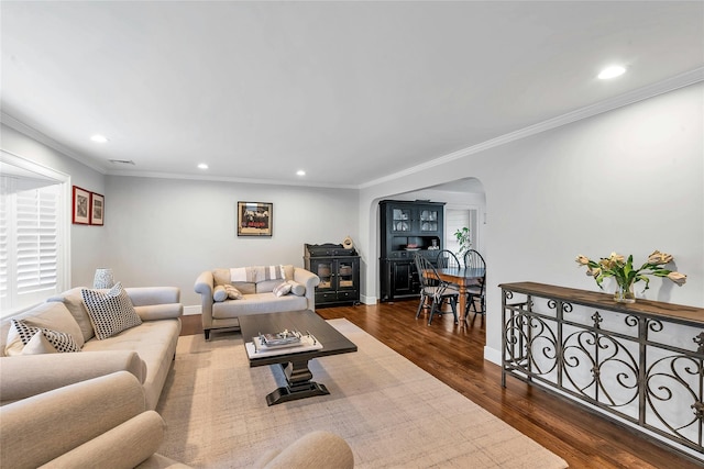 45 Pool Dr, Roslyn, NY 11576 - living room featuring arched walkways, recessed lighting, wood finished floors, crown molding, and baseboards