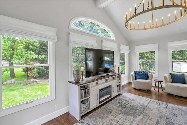 45 Pool Dr, Roslyn, NY 11576 - living room featuring healthy amount of natural light, dark wood-type flooring, high vaulted ceiling, beamed ceiling, and baseboards