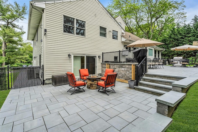 45 Pool Dr, Roslyn, NY 11576 - view of patio featuring a fire pit