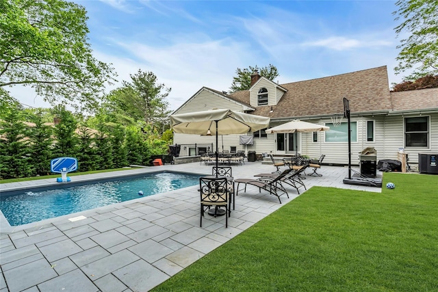 45 Pool Dr, Roslyn, NY 11576 - outdoor pool with a lawn, a patio area, and central AC