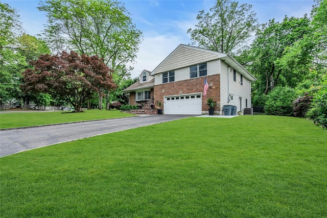 45 Pool Dr, Roslyn, NY 11576 - view of front facade featuring driveway, an attached garage, a front yard, and cooling unit