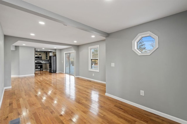 945 Homestead Ave, Maybrook, NY 12543 - unfurnished living room with recessed lighting, baseboards, and light wood-style flooring