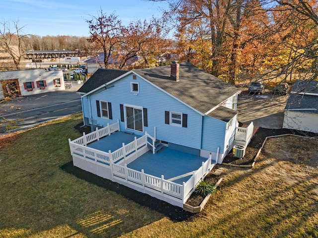 945 Homestead Ave, Maybrook, NY 12543 - back of house with a shingled roof, cooling unit, a chimney, and a yard