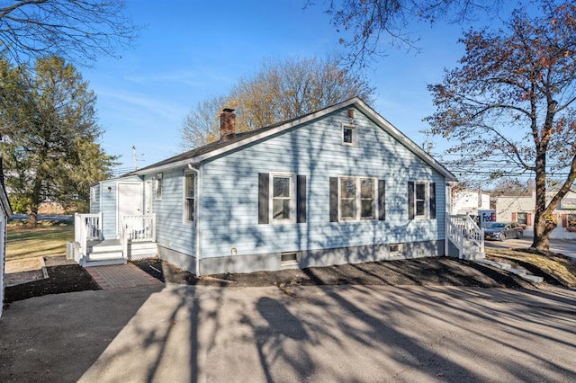 945 Homestead Ave, Maybrook, NY 12543 - view of side of home with a chimney