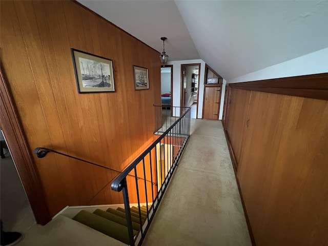 53 Canterbury Ln, North Babylon, NY 11703 - staircase featuring lofted ceiling and wood walls