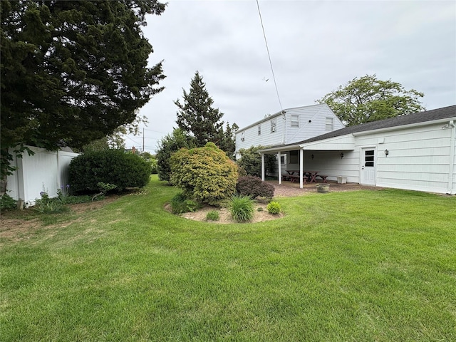 53 Canterbury Ln, North Babylon, NY 11703 - view of green lawn featuring a patio area
