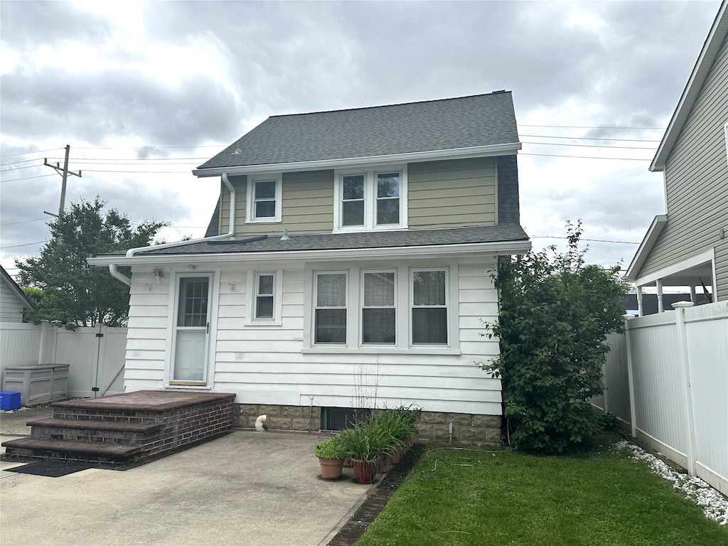 138 Oceanview Rd, East Rockaway, NY 11518 - rear view of house featuring a shingled roof and a patio area