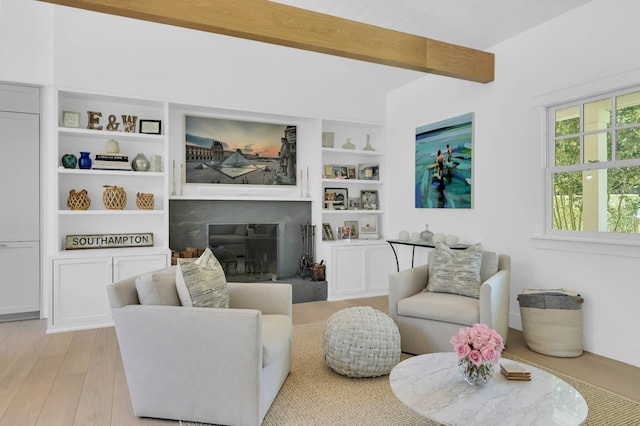 2 Longview Rd, Southampton, NY 11968 - living room featuring wood finished floors, beam ceiling, and built in shelves