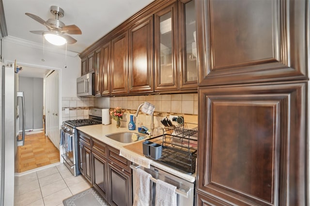 60 Barker St Unit 417, Mount Kisco, NY 10549 - kitchen with stainless steel appliances, a ceiling fan, a sink, decorative backsplash, and light countertops