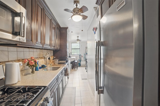 60 Barker St Unit 417, Mount Kisco, NY 10549 - kitchen featuring stainless steel appliances, a ceiling fan, backsplash, and light tile patterned floors