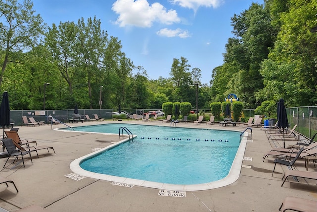 60 Barker St Unit 417, Mount Kisco, NY 10549 - community pool featuring a patio and view of wooded area
