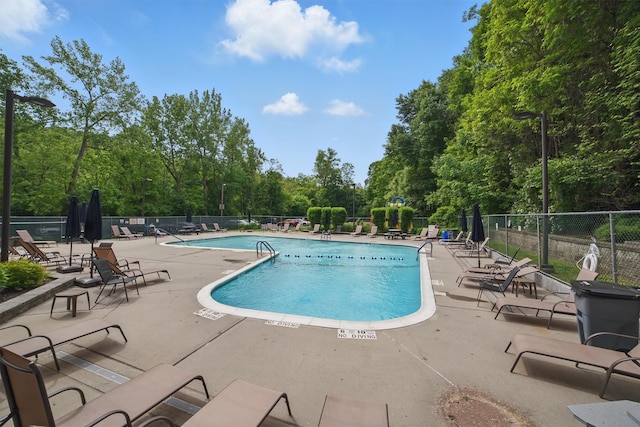 60 Barker St Unit 417, Mount Kisco, NY 10549 - community pool featuring a patio and view of scattered trees