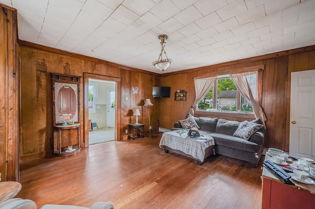 96 Toomey Rd, West Islip, NY 11795 - living area featuring wooden walls, hardwood / wood-style flooring, baseboard heating, and crown molding