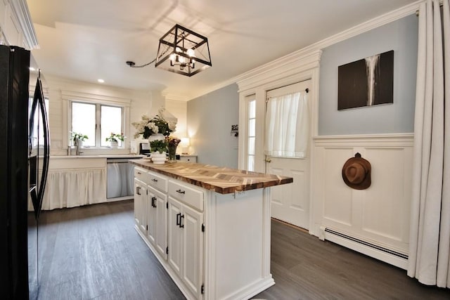 3454 State Route 208, Campbell Hall, NY 10916 - kitchen featuring butcher block countertops, stainless steel dishwasher, black refrigerator with ice dispenser, baseboard heating, and a chandelier