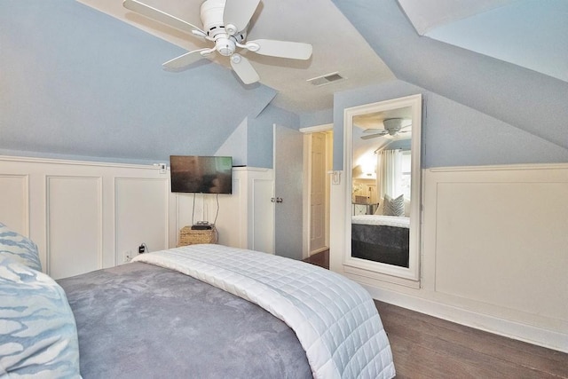 3454 State Route 208, Campbell Hall, NY 10916 - bedroom featuring dark wood-type flooring, vaulted ceiling, wainscoting, a decorative wall, and ceiling fan