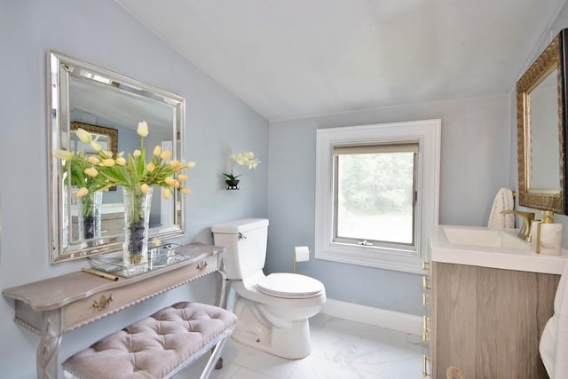 3454 State Route 208, Campbell Hall, NY 10916 - bathroom with marble finish floors, toilet, vanity, lofted ceiling, and baseboards