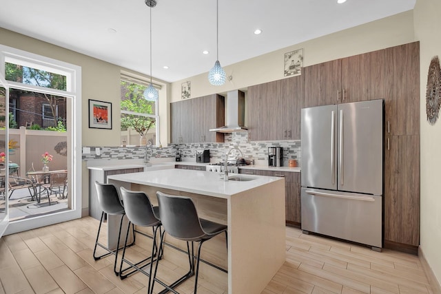 459 Vanderbilt Ave, Brooklyn, NY 11238 - kitchen featuring freestanding refrigerator, wall chimney exhaust hood, light countertops, tasteful backsplash, and recessed lighting