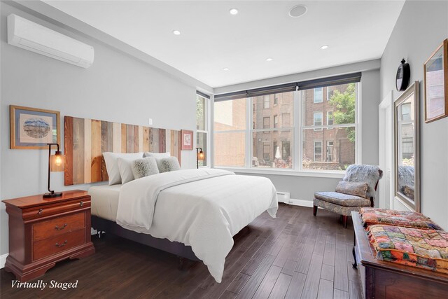 459 Vanderbilt Ave, Brooklyn, NY 11238 - bedroom featuring a wall unit AC, dark wood finished floors, baseboards, and recessed lighting