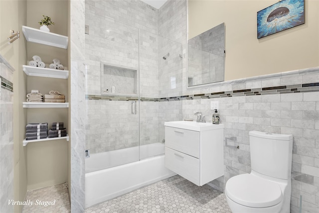 459 Vanderbilt Ave, Brooklyn, NY 11238 - bathroom with toilet, vanity, bath / shower combo with glass door, tile walls, and wainscoting