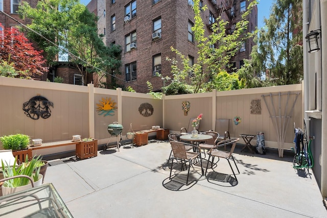 459 Vanderbilt Ave, Brooklyn, NY 11238 - fenced backyard with a patio, a grill, and cooling unit
