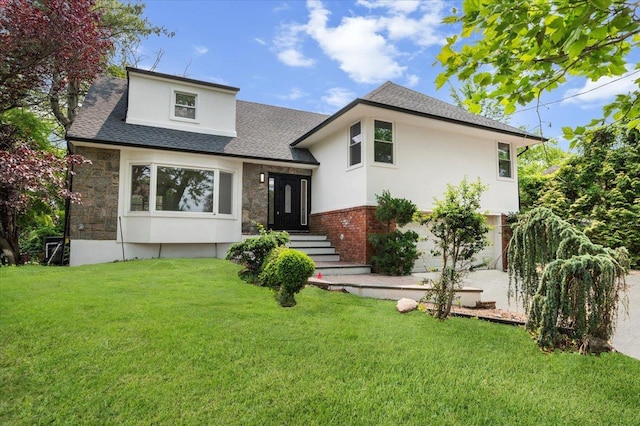 559 Linda Ln, Woodmere, NY 11598 - rear view of house with stone siding, a lawn, a shingled roof, and stucco siding