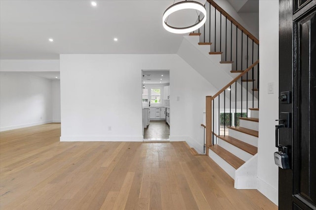 559 Linda Ln, Woodmere, NY 11598 - foyer entrance featuring light wood-style floors, stairs, recessed lighting, and baseboards