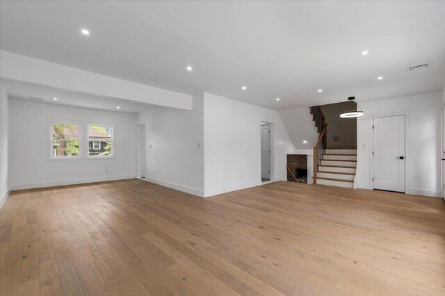 559 Linda Ln, Woodmere, NY 11598 - unfurnished living room with light wood-type flooring, baseboards, stairs, and recessed lighting
