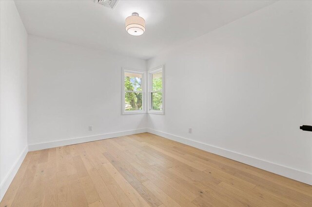 559 Linda Ln, Woodmere, NY 11598 - unfurnished room with baseboards and light wood-style flooring