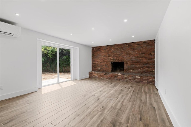 559 Linda Ln, Woodmere, NY 11598 - unfurnished living room featuring a brick fireplace, wood finished floors, a wall mounted AC, recessed lighting, and baseboards