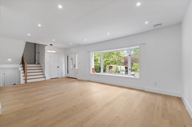 559 Linda Ln, Woodmere, NY 11598 - unfurnished living room featuring stairway, recessed lighting, baseboards, and light wood-style flooring