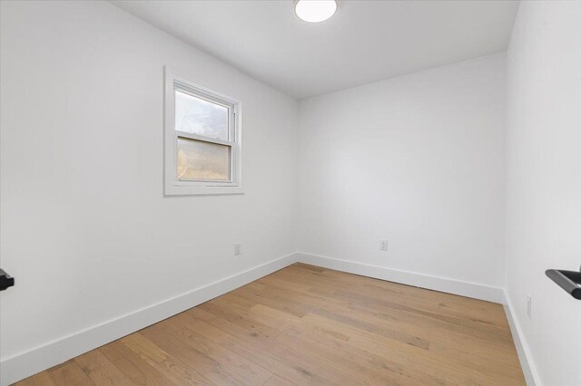 559 Linda Ln, Woodmere, NY 11598 - empty room with baseboards and light wood-type flooring