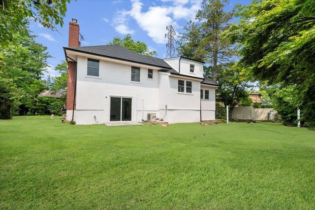 559 Linda Ln, Woodmere, NY 11598 - rear view of property with a chimney and stucco siding