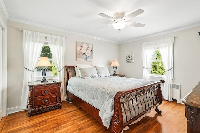 114 Longview Ave, White Plains, NY 10605 - bedroom with radiator heating unit, wood-type flooring, ornamental molding, and ceiling fan
