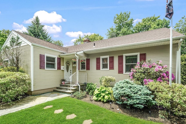114 Longview Ave, White Plains, NY 10605 - ranch-style home featuring a chimney, a front lawn, and roof with shingles