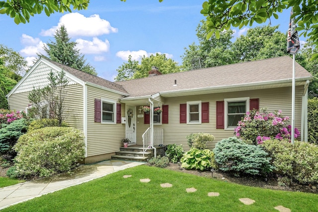 114 Longview Ave, White Plains, NY 10605 - ranch-style home with a chimney, a front yard, and a shingled roof
