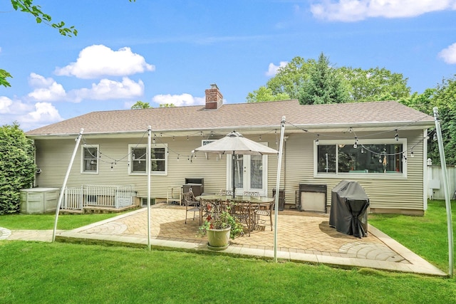 114 Longview Ave, White Plains, NY 10605 - back of property featuring a chimney, a yard, and a patio