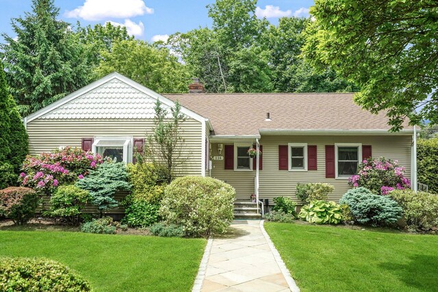 114 Longview Ave, White Plains, NY 10605 - view of front of property featuring a front lawn and a chimney