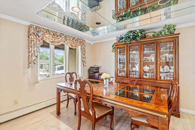 48 Fairfield Dr, Dix Hills, NY 11746 - dining room with light wood finished floors, ornamental molding, baseboard heating, and baseboards
