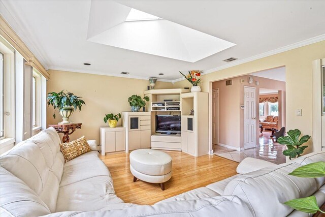 48 Fairfield Dr, Dix Hills, NY 11746 - living area with a skylight, crown molding, and light wood-style flooring