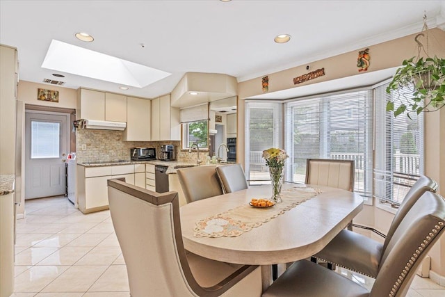 48 Fairfield Dr, Dix Hills, NY 11746 - dining space featuring a skylight, light tile patterned flooring, and recessed lighting