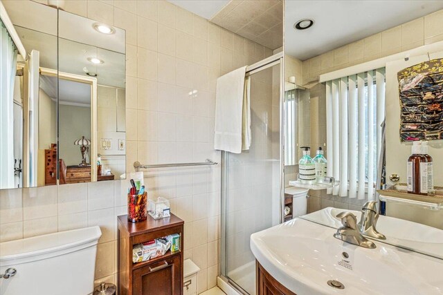 48 Fairfield Dr, Dix Hills, NY 11746 - full bath featuring tile walls, toilet, a stall shower, and vanity