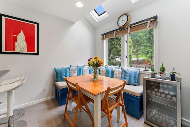 41 Boulder Ridge Rd, Scarsdale, NY 10583 - dining room featuring a skylight, lofted ceiling, breakfast area, baseboards, and wine cooler