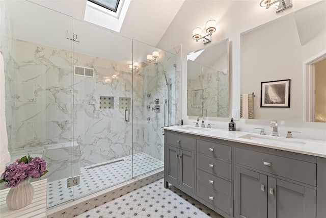 41 Boulder Ridge Rd, Scarsdale, NY 10583 - full bath with a skylight, a marble finish shower, double vanity, lofted ceiling, and tile patterned floors