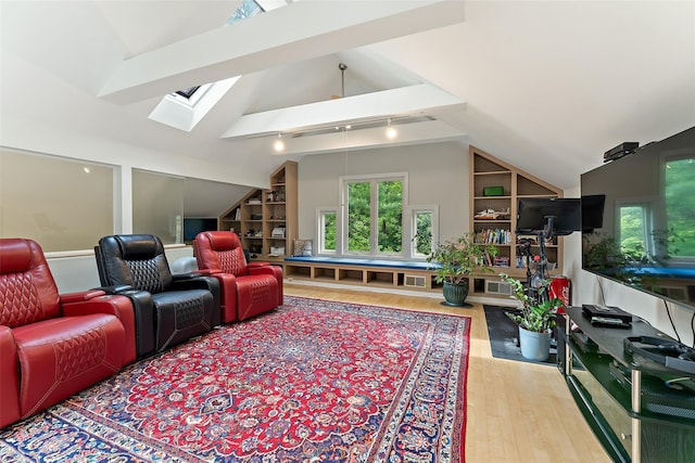 41 Boulder Ridge Rd, Scarsdale, NY 10583 - cinema room with a skylight, wood finished floors, and built in shelves