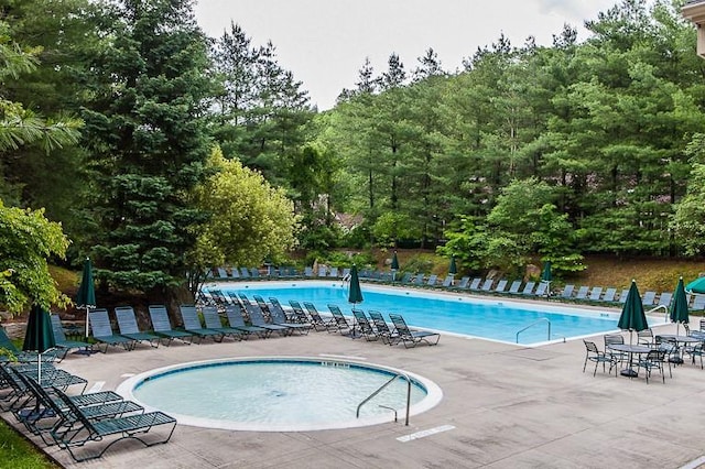 41 Boulder Ridge Rd, Scarsdale, NY 10583 - community pool featuring a patio and view of wooded area